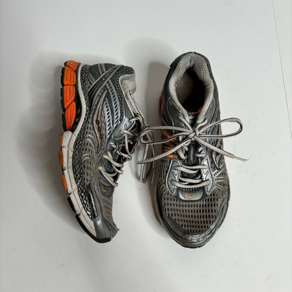 Saucony grey and orange running shoes 8